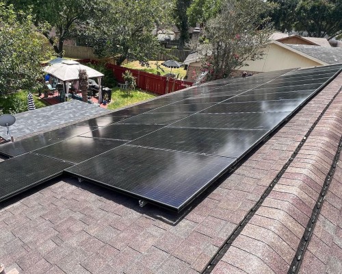 A house with a solar panel on the roof showcasing its positive environmental impact.